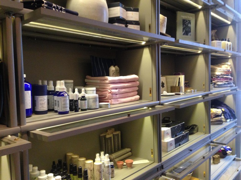 Lockable storage shelves with Integrated lighting at the Wythe Shop.